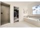 Bright bathroom features a tiled shower, soaking tub, and walk-in closet for optimal relaxation at 2987 Jefferson St, Atlanta, GA 30341