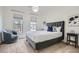 Well-lit bedroom features cozy carpet, plush bed, and two windows offering ample natural light at 2987 Jefferson St, Atlanta, GA 30341