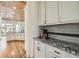 Well-appointed kitchen featuring custom cabinets, granite countertops and hardwood floors at 2987 Jefferson St, Atlanta, GA 30341