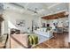 Open-concept living area with coffered ceilings flows into a kitchen with a breakfast bar and updated appliances at 2987 Jefferson St, Atlanta, GA 30341