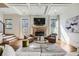Bright and inviting living room showcasing a stone fireplace, coffered ceilings, and comfortable seating arrangements at 2987 Jefferson St, Atlanta, GA 30341