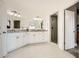 Elegant primary bathroom with double vanity, granite counters, and walk-in shower providing a spa-like experience at 2987 Jefferson St, Atlanta, GA 30341