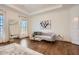 Airy bedroom featuring a cozy seating area with a modern sofa and large windows offering serene views at 2987 Jefferson St, Atlanta, GA 30341