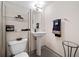 Bathroom features a pedestal sink, and gray tiled floors at 319 Atlanta Se St # 315, Marietta, GA 30060