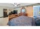 Bedroom with a built-in desk and cabinets and sliding barn door to the bathroom at 319 Atlanta Se St # 315, Marietta, GA 30060