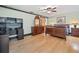 Spacious bedroom features wood floors, ceiling fan, and a sliding barn door to the Primary bath at 319 Atlanta Se St # 315, Marietta, GA 30060
