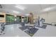 Well-equipped gym featuring various machines and weights, with large windows for natural light at 319 Atlanta Se St # 315, Marietta, GA 30060