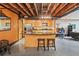 Open concept kitchen with an island, stainless steel appliances, and exposed ceiling beams at 319 Atlanta Se St # 315, Marietta, GA 30060