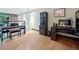 Living room with a piano, built-in desk and cabinets, and lofted windows at 319 Atlanta Se St # 315, Marietta, GA 30060