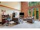 Cozy living room with exposed brick wall and large windows offering scenic views at 319 Atlanta Se St # 315, Marietta, GA 30060