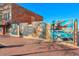 Outdoor art gallery featuring colorful mural and pictures on the side of a brick building at 319 Atlanta Se St # 315, Marietta, GA 30060