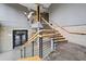 Modern staircase with wooden steps and metal railings, leading to the upper levels of the building at 319 Atlanta Se St # 315, Marietta, GA 30060