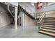 Open staircase design with concrete floors and brick accents provides unique visual appeal at 319 Atlanta Se St # 315, Marietta, GA 30060