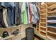 A functional walk-in closet with shelves, clothes racks and space for luggage at 319 Atlanta Se St # 315, Marietta, GA 30060