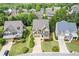 Beautiful aerial view of the home and neighborhood showcasing lush greenery, well-maintained lawns, and mature trees at 3750 Sweeting St, Cumming, GA 30041
