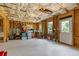 Unfinished basement with exposed wood and storage, offering potential for customization at 3750 Sweeting St, Cumming, GA 30041