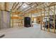 Unfinished basement with exposed insulation, concrete floor, and exercise area at 3750 Sweeting St, Cumming, GA 30041