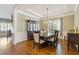 Elegant dining room featuring a coffered ceiling, hardwood floors, and classic decor at 3750 Sweeting St, Cumming, GA 30041
