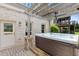 Outdoor hot tub with adjacent entrance providing a luxurious and private space for relaxation and rejuvenation at 3750 Sweeting St, Cumming, GA 30041