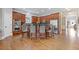 Well-equipped kitchen with stainless steel appliances, a large island, and stylish hardwood floors at 3750 Sweeting St, Cumming, GA 30041