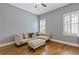 Bright sitting room featuring hardwood floors and lots of natural light at 3750 Sweeting St, Cumming, GA 30041