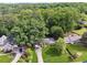 Charming home with a well-manicured front lawn, mature trees, and a long driveway leading to the entrance at 500 Read Ln, Atlanta, GA 30328