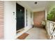 Inviting front porch with a bench, brick accents, and a charming entrance at 500 Read Ln, Atlanta, GA 30328