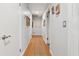 Hallway with hardwood floors and neutral wall paint with doorways leading to various rooms at 500 Read Ln, Atlanta, GA 30328