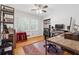 Office featuring natural light, hardwood flooring, and built-in shelving providing functional and aesthetic appeal at 500 Read Ln, Atlanta, GA 30328