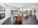 Open kitchen and dining area with a fireplace, stainless steel appliances, and access to a screened-in porch at 500 Read Ln, Atlanta, GA 30328