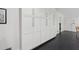 Floor-to-ceiling built-in white cabinets with stainless hardware, complemented by sleek black floors at 500 Read Ln, Atlanta, GA 30328