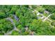 Aerial view of the home situated among mature trees, providing a sense of seclusion and privacy at 588 Benson Hurst Sw Dr, Mableton, GA 30126