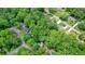 Aerial view of the property surrounded by lush greenery and mature trees at 588 Benson Hurst Sw Dr, Mableton, GA 30126