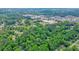 Scenic aerial view showcasing the dense tree cover and tranquil neighborhood at 588 Benson Hurst Sw Dr, Mableton, GA 30126