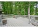 Large wooden deck is perfect for relaxing and enjoying the serene wooded surroundings at 588 Benson Hurst Sw Dr, Mableton, GA 30126