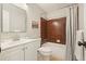 Bathroom with a tub and shower combo, a white vanity and mirror above the commode at 588 Benson Hurst Sw Dr, Mableton, GA 30126