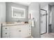 Stylish bathroom featuring a vanity and walk-in shower with black trim at 588 Benson Hurst Sw Dr, Mableton, GA 30126