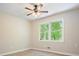 Bedroom featuring wood-look flooring, a ceiling fan and a sun-filled window at 588 Benson Hurst Sw Dr, Mableton, GA 30126