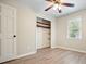 Bedroom features include flooring, closet, window with natural light and a ceiling fan at 588 Benson Hurst Sw Dr, Mableton, GA 30126