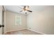 Bright bedroom featuring wood-look flooring, ceiling fan, and natural light at 588 Benson Hurst Sw Dr, Mableton, GA 30126