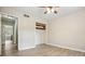 Bedroom featuring wood-look flooring, a ceiling fan and an adjacent closet at 588 Benson Hurst Sw Dr, Mableton, GA 30126