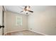 This bright bedroom offers a ceiling fan and a window with natural light at 588 Benson Hurst Sw Dr, Mableton, GA 30126