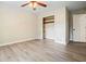 Bedroom featuring a ceiling fan, closet and light colored floors at 588 Benson Hurst Sw Dr, Mableton, GA 30126