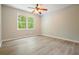 Bright bedroom with hardwood flooring, and a window with great natural light at 588 Benson Hurst Sw Dr, Mableton, GA 30126
