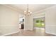 View of the dining room with hardwood floors and openings to the kitchen and living room at 588 Benson Hurst Sw Dr, Mableton, GA 30126
