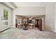 Tiled foyer space featuring a view into the living room with its chairs, table, and outside access at 588 Benson Hurst Sw Dr, Mableton, GA 30126