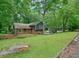 Charming home with a well-manicured lawn, stone accents, and a welcoming entrance, exuding curb appeal at 588 Benson Hurst Sw Dr, Mableton, GA 30126