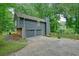 Attached two-car garage with additional driveway parking, offering convenience and ample space at 588 Benson Hurst Sw Dr, Mableton, GA 30126