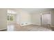 Neutral living space with hardwood floors and an adjacent dining area at 588 Benson Hurst Sw Dr, Mableton, GA 30126