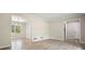 Bright living room space showcasing wood floors and access to other rooms at 588 Benson Hurst Sw Dr, Mableton, GA 30126